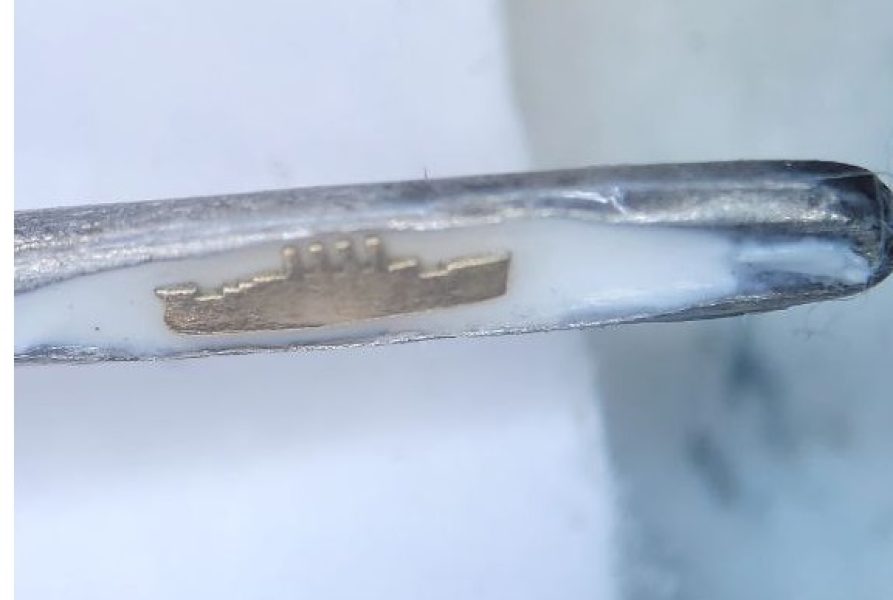 Micro Art NFT. Titanic in the eye of a needle. Micro miniature.